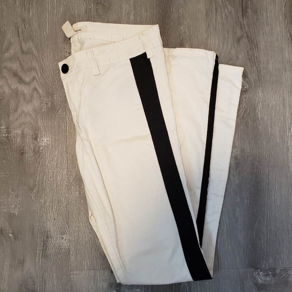 White jeans with thin black velvet stripe on leg